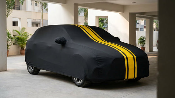 Maruti Suzuki Baleno fitted with a matte black DriveCult Spyro car body cover with twin yellow stripes