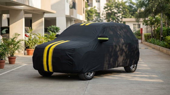 Maruti Suzuki Brezza fitted with a matte black DriveCult Spyro car body cover with twin yellow stripes
