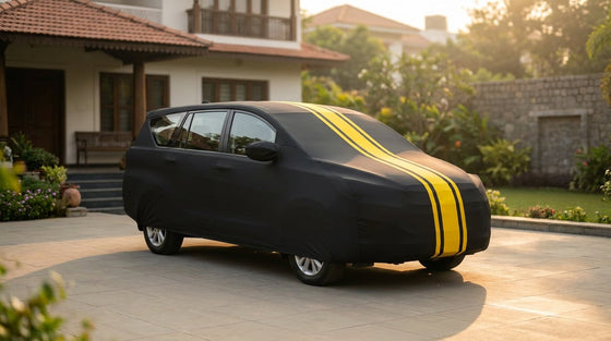 Maruti Suzuki Ertiga fitted with a matte black DriveCult Spyro car body cover with twin yellow stripes