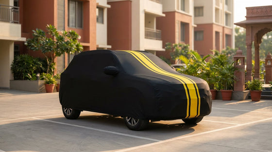 Tata Punch fitted with a matte black DriveCult Spyro car body cover with twin yellow stripes