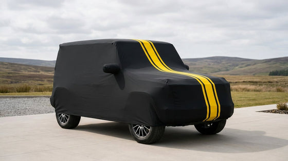 Mahindra Thar Roxx fitted with a matte black DriveCult Spyro car body cover with twin yellow stripes