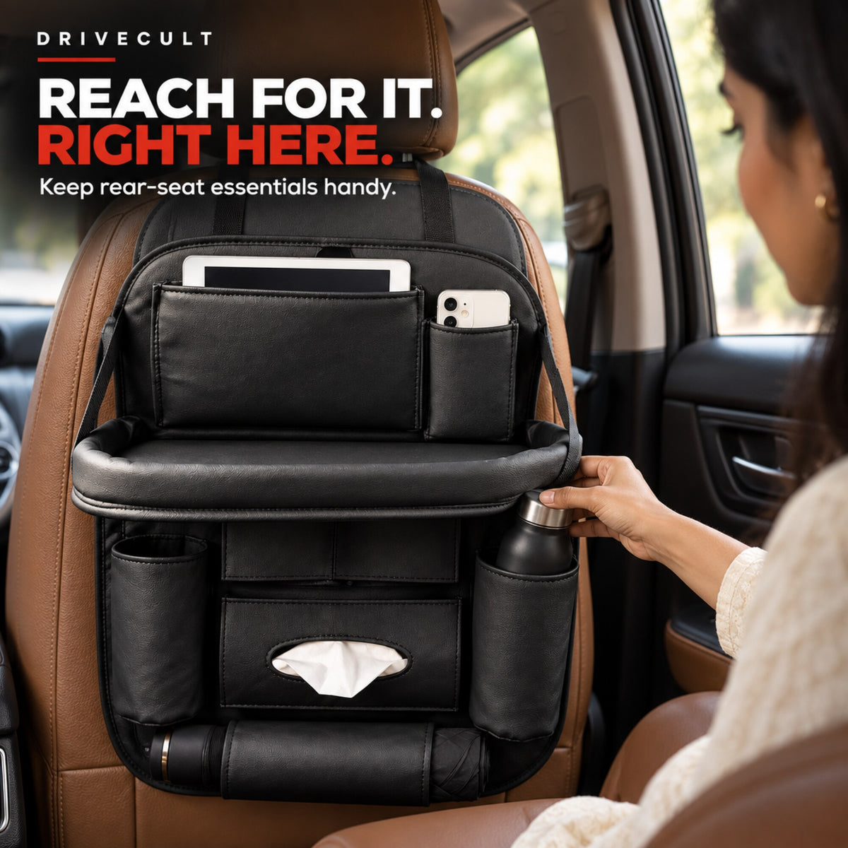 Rear passenger reaching for a bottle in the back seat organiser